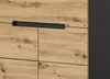 A close-up view of a wooden cabinet with a black handle. Produktbild-Vorschau