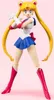 A Sailor Moon action figure against a pink background. Produktbild-Vorschau