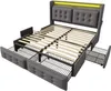 A grey upholstered bed frame with wooden slats and built-in drawers, illuminated by yellow LED lights. Náhľad obrázku produktu