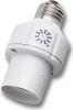 A white lamp adapter with a timer dial. Produktbild-Vorschau