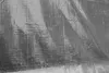A close-up, textured view of a metallic-looking tarp or fabric. Produktbild-Vorschau