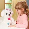 A young girl is playing with a white stuffed dog. Podgląd zdjęcia produktu