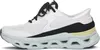 Side view of a white athletic shoe with black and pale yellow accents. Voir les images du produit