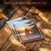 Two clear photo frames with photos of a sunset and a person standing in front of it, placed on a wooden surface. Produktbild-Vorschau