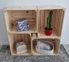 Wooden crates stacked to form shelving, with decorative items inside. Náhled obrázku produktu