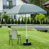 A garden scene with a chair and umbrella. Produktbild-Vorschau