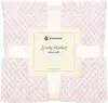 A folded pink blanket with a textured pattern, tied with a white ribbon and a product label. Anteprima dell’immagine prodotto