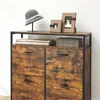 A close-up view of a vintage-style shoe cabinet with drawers. Náhled obrázku produktu