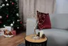 A decorative LED tree lamp sits on a side table next to a Christmas tree and gifts. Anteprima dell’immagine prodotto