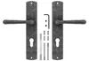 A pair of door handles with their mounting hardware, laid out on a white background. Produktbild-Vorschau