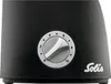 Close-up of a black appliance with a silver dial. Podgląd zdjęcia produktu