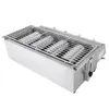 A stainless steel gas grill with a grate and charcoal inside, shown from a slightly elevated side angle against a white background. Produktbild-Vorschau