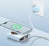 A smartphone is wirelessly charging on a power bank, which is plugged into a wall socket via a charger and cable. Produktbild-Vorschau
