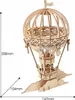 A wooden 3D model of a hot air balloon with clouds at its base, with dimensions indicated by lines and text. Anteprima dell’immagine prodotto
