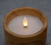A close-up shot of an LED candle with a wooden exterior and a white flame. Voir les images du produit