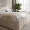 A bedroom scene with a large bed, curtains, and a plant. Produktbild-Vorschau
