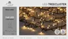 A close-up of LED tree cluster lights on a wooden surface, with a grey panel on the left showing product details and branding. Produktbild-Vorschau