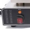 A close-up view of the control panel of a waffle maker, showing temperature settings, a heat indicator light, and an on/off switch. Produktbild-Vorschau