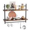 A two-tiered industrial-style shelf unit with kitchenware and decorative items. Anteprima dell’immagine prodotto