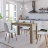 A dining table and chairs set in a bright, modern kitchen. Náhled obrázku produktu