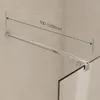 A close-up view of a shower screen stabilizer bar mounted on a textured wall, with a measurement indicator. Produktbild-Vorschau