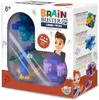 The image shows the retail packaging of a Brain Buster puzzle game, with the product visible through a clear plastic window. Anteprima dell’immagine prodotto
