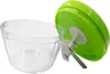 A manual vegetable chopper with a clear bowl and a green lid, shown with the lid slightly ajar. Produktbild-Vorschau