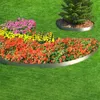 A garden bed with colorful flowers and a tree, bordered by metal edging. Produktbild-Vorschau
