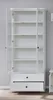 An open white bookshelf with glass doors and two drawers at the bottom, placed on a wooden floor against a light gray wall. Produktbild-Vorschau