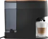 A side view of a coffee machine with a glass of latte on the drip tray. Produktbild-Vorschau