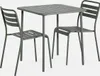 A khaki-colored metal garden table with two chairs, shown against a light gray background. Produktbild-Vorschau