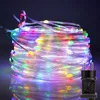 A coiled string of colorful LED lights with a black power adapter. Produktbild-Vorschau