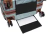 The bottom part of a teal suitcase with brown accents and black wheels. A white flap with black trim is extended from the bottom of the suitcase. Náhľad obrázku produktu