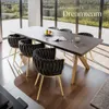 A dining table and chairs set in a modern dining room with a large window overlooking a landscape. Náhled obrázku produktu