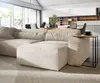 A modern living room with a large sectional sofa, dining area, and kitchen in the background. Produktbild-Vorschau