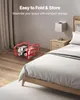 A bedroom scene showing a folded emergency ladder on the floor next to a bed. Produktbild-Vorschau