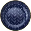 A top-down view of a dark blue bowl with a white herringbone pattern and a gold rim. Voir les images du produit