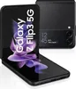 A black Samsung Galaxy Z Flip3 5G phone is shown in an open, angled position against a white background. The phone's screen displays a purple floral graphic and the text 'Galaxy Z Flip3 5G'. A second, closed phone is visible in the background. Náhľad obrázku produktu