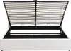 A white upholstered bed frame with the mattress support mechanism open, revealing the storage space underneath. Produktbild-Vorschau