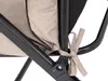 A close-up view of a beige cushion tied to a black metal chair frame with beige fabric ties. Náhled obrázku produktu