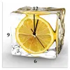 A clock with a lemon slice frozen in an ice cube. Produktbild-Vorschau