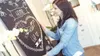 A woman is holding up a chalkboard with chalk art on it. Produktbild-Vorschau