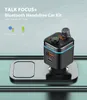 A black Bluetooth handsfree car kit with a movable mic probe is shown on a metallic gray car console. Produktbild-Vorschau