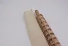 A wooden rolling pin with a grid pattern and a fabric storage bag are shown on a white background. Produktbild-Vorschau
