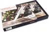 A close-up, angled view of a Böker Plus Advent Calendar box, designed to hold knives, with a festive, bokeh background. Náhled obrázku produktu