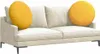 A cream-colored sofa with two round yellow cushions. Podgląd zdjęcia produktu