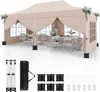 A beige pop-up canopy tent set up with tables and chairs inside, with accessories laid out below. Produktbild-Vorschau