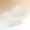 A white and beige baby potty trainer is shown from a side angle against a gradient background. Produktbild-Vorschau