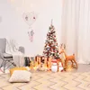 A decorated Christmas tree with gifts and festive decorations in a cozy room setting. Produktbild-Vorschau