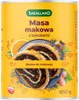 A can of Bakalland Masa makowa (poppy seed filling with dried fruits) with a slice of poppy seed roll on a plate, surrounded by decorative elements like orange slices and poppy seeds. Podgląd zdjęcia produktu